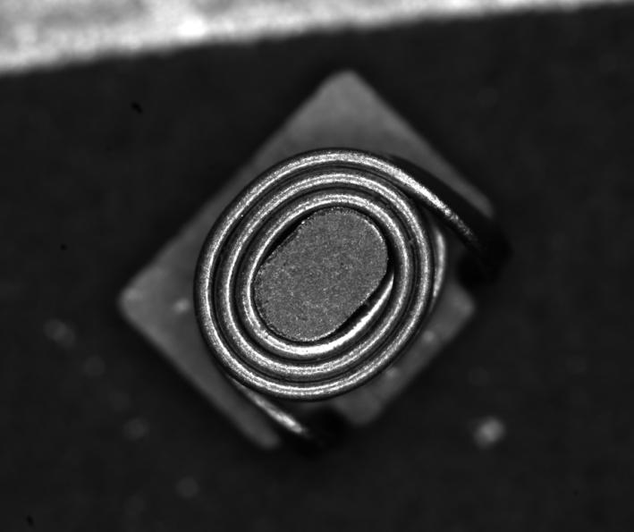OPTIGER 2x lens inspecting a small inductor (magnified view)